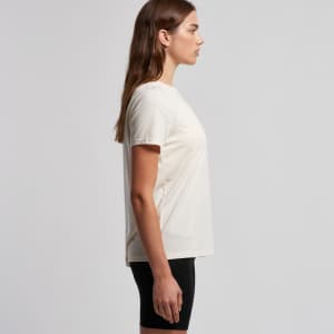 A light cream T-shirt is shown, featuring a crew neck and short sleeves, with a branding logo on it.