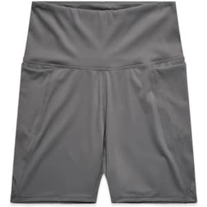 Active bike shorts in grey, featuring a high waistband and side pockets, with a simple brand logo.