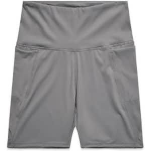 Active bike shorts in a smooth grey fabric, featuring two side pockets and a wide waistband, with a logo displayed.