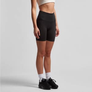 Active bike shorts in black, featuring a high waistband and a slim fit, displayed on a model.
