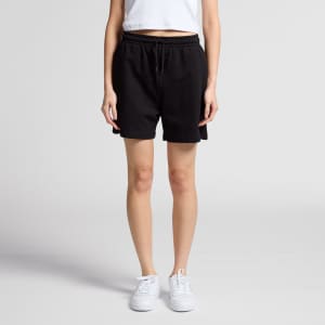 Black sports shorts with an adjustable waistband, featuring a logo, worn with a plain white top and white sneakers.