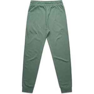 A pair of green premium track pants with an elastic waistband and ribbed cuffs. The pants have a logo.