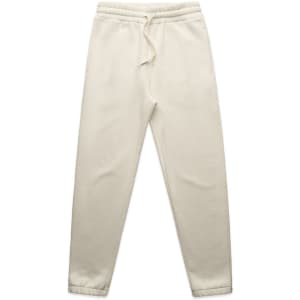 Track pants in a light cream colour with an elastic waistband and side pockets. Features a logo on the waistband.