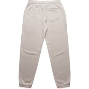 Light beige track pants with an elastic waistband, featuring a single back pocket and ribbed cuffs. Includes branding.