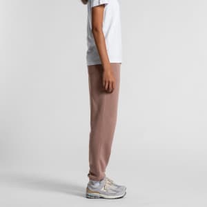 Track pants in a soft brown hue, featured alongside a plain white t-shirt and grey sneakers.