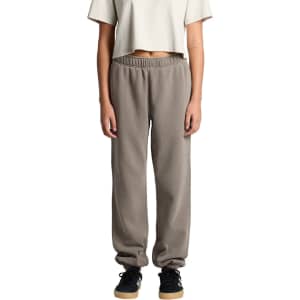 Faded track pants in grey, featuring a relaxed fit with elastic cuffs and waistband, modelled by a person.