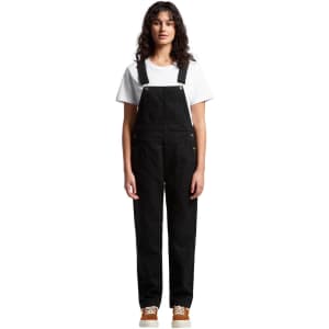 Black canvas overalls worn over a white t-shirt, featuring adjustable straps and pockets.