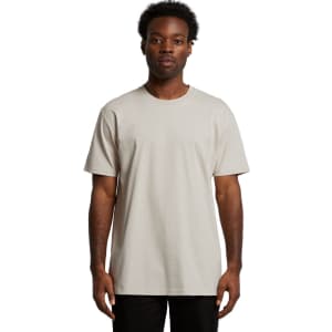 A plain, light grey t-shirt on a person, featuring short sleeves and a crew neckline, with a logo on the fabric.