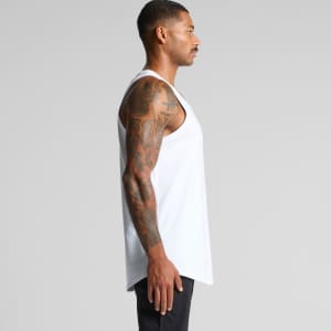 A white singlet with a loose fit, displayed on a model showcasing its side profile and tattoos.