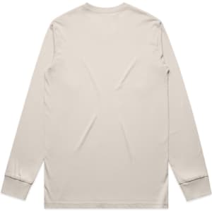 A long-sleeved, cream-coloured t-shirt with a plain back and fitted cuffs. It features a small logo.