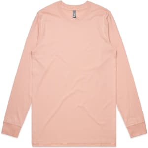A long-sleeve t-shirt in a soft peach colour, featuring a branded label.