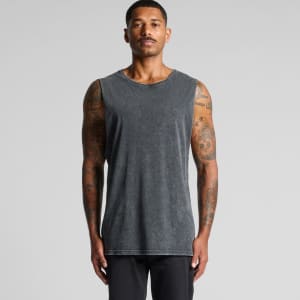 A man wearing a stone-wash grey tank top with a crew neck and armholes, featuring a logo.