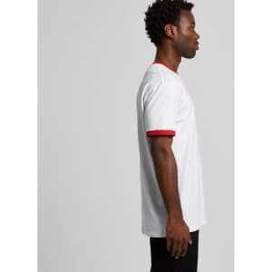 A white T-shirt with red sleeves and a casual fit, displayed on a model from the side. The shirt has a logo.