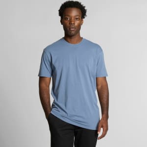 A light blue T-shirt with a relaxed fit, featuring a logo on the front, displayed on a model.