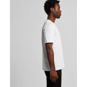 A side view of a white T-shirt, featuring a loose fit and a logo on the garment.