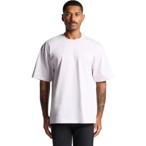 A model wearing a loose-fitting, short-sleeve t-shirt in light purple, featuring a logo on the front.