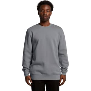 A grey hoodie is displayed on a male model, featuring a classic crew neck and long sleeves, with a logo present.