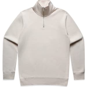 A beige half zip crew jumper with long sleeves and a zipper at the neck. It features a logo on the design.