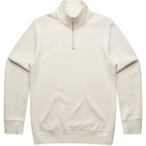 A cream-coloured half zip crew jumper, featuring long sleeves and a zippered collar, with a logo on the front.