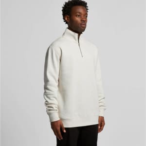 A cream-coloured half zip crew jumper designed for comfort, featuring a stand-up collar and long sleeves.