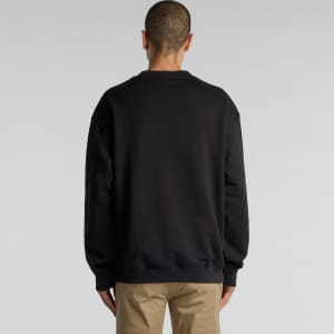 A black jumper with a relaxed fit, featuring a plain back design. The model is facing away from the camera.