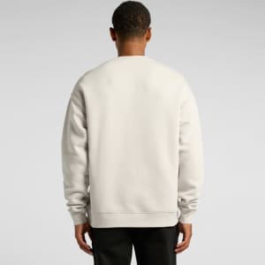 A light grey sweater with a relaxed fit, featuring a plain back and long sleeves. It has a small logo on the back.