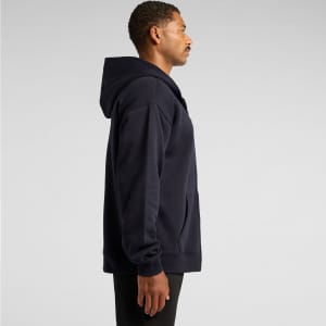 A navy zip-up hoodie displayed on a model from the side, featuring a hood and front pocket.