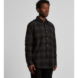A button-up shirt in black and grey check pattern, featuring long sleeves and a collar, with a logo present.