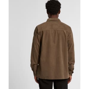 A cord shirt in brown, featuring a button-up design and a logo on the back.