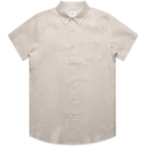 A short-sleeved, button-up linen shirt in a light beige colour, featuring a chest pocket and a collar.