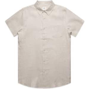 A short-sleeved, button-up linen shirt in a light beige colour with a front pocket and a collar.