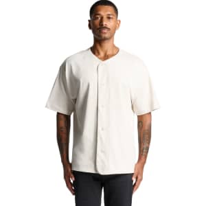 A heavy baseball jersey in a cream colour with a button front and short sleeves. It features a logo on the chest.