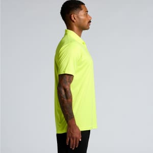 A side view of a bright yellow polo shirt with a casual fit, featuring a logo on the chest.