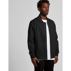 A black bomber jacket displayed on a model, featuring a zip closure and long sleeves. The jacket has a logo on it.