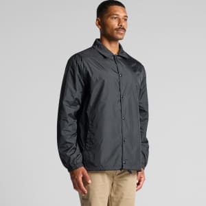 A black coach jacket featuring a point collar and elasticised cuffs, with a logo present.