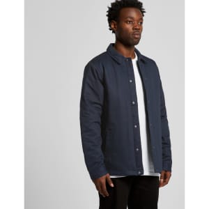 A work jacket in navy blue, featuring a collar and button-up front, worn by a standing male model.