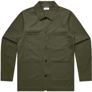 A khaki green chore jacket with a collared neck and four front pockets. The jacket features a logo on the label.