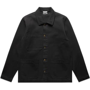 A black canvas chore jacket featuring a collared neck, button closure, and multiple front pockets.