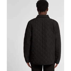 A black quilted puffer jacket with a diamond pattern, viewed from the back on a model.