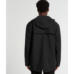 A black rain jacket featuring a hood and a back vent, with a branding logo on the garment.
