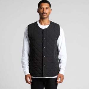 A black quilted vest with a snap button front, displayed on a model wearing a white shirt underneath.