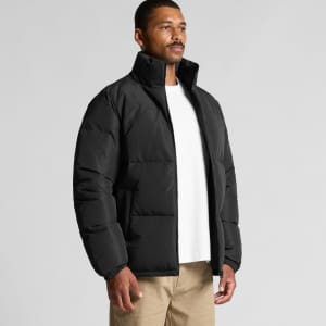 A black puffer jacket with a high collar and zip front, worn by a man against a plain background.