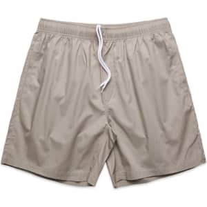 Beige beach shorts with an elastic waistband and white drawstring. Features a logo on the waistband.