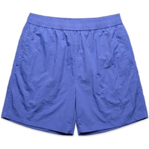 Swim shorts in a solid light blue shade with elastic waistband and a logo. Suitable for various casual activities.