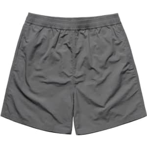 A pair of grey swim shorts with an elastic waistband and a simple design. Features a logo.