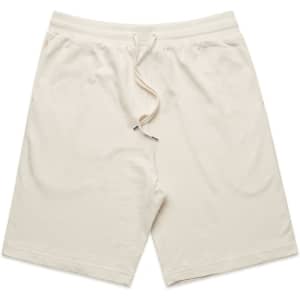 Light beige sports shorts with an elastic waistband and drawstring, featuring a logo on one side.