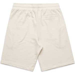 A pair of cream-coloured sports shorts featuring a back pocket and an elastic waistband.