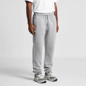 Grey track pants displayed on a person, featuring an elastic waistband and cuffs, with a logo present.