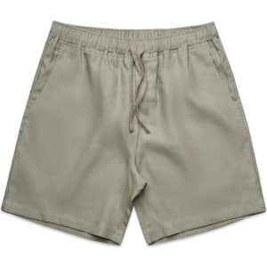 Linen dress shorts in a muted green shade, featuring an elastic waistband and drawstring.