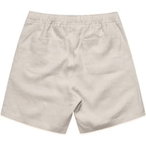 Linen shorts in a light beige colour featuring an elastic waistband and two back pockets.